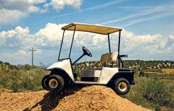 Golf cart stuck on top of dirt mound Photos courtesy of: Stock.com/GregC (1); Matt Cavanaugh