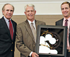 Frank Siple (middle) with his Distinguished Service Award, presented by past U.S. Open champion Jerry Pate, left, and Jamie Pate, of the Jerry Pate Co., right. (Photo: Georgia GCSA)