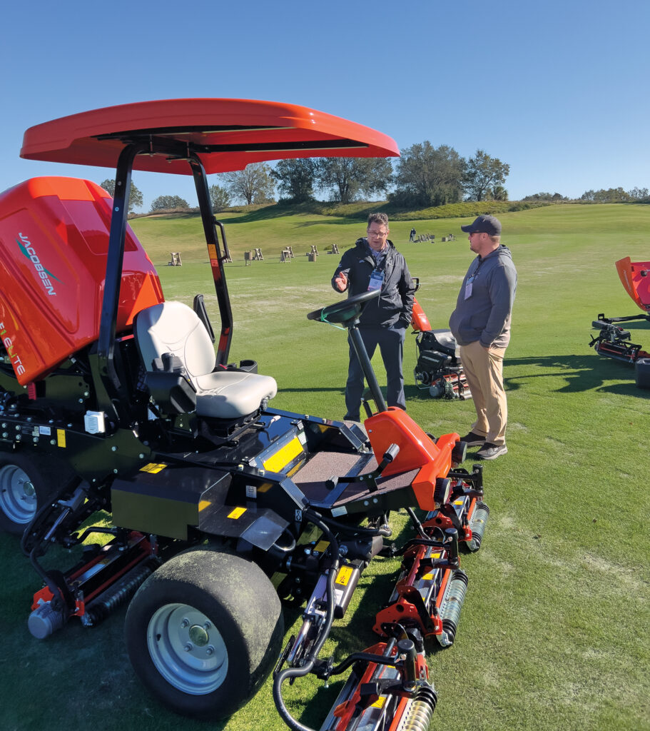 Lee Frie, product manager for Jacobsen, chats with Joshua Goodhart, Avalon G&CC, Warren, Ohio. (Photo: Golfdom staff)