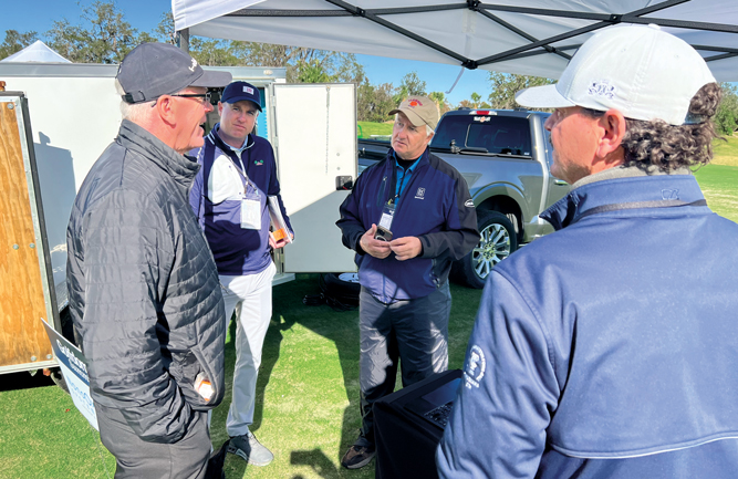 Mike Bugenhagen (left), The Club at Hokulia, and Ron Pote (middle), owner, NanoOxygen Systems, discuss the importance of water quality. (Photo: Golfdom staff)