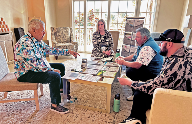 Jim Turner (left), founder, Numerator Technologies, and Taylor Turner, CEO, talk surfactants with Justin Woodland, The Barn GC and Joshua Krane, Glenwild GC. (Photo: Golfdom staff)