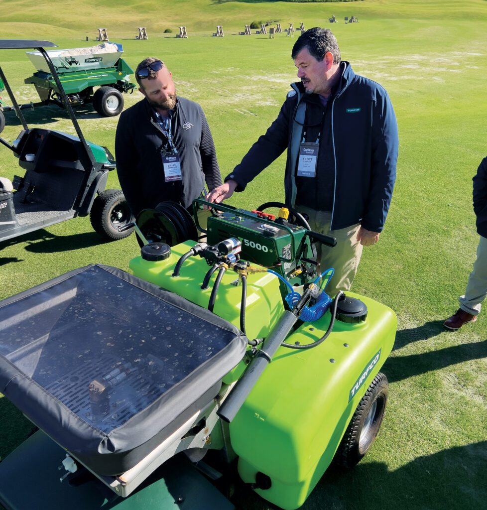 Brian Dearstine, The Preserve at Eisenhower, Crownsville, Md., listens as Scott Kinkead, executive vice president, Turfco, shows the features of the T5000 spreader/sprayer. (Photo: Golfdom staff)