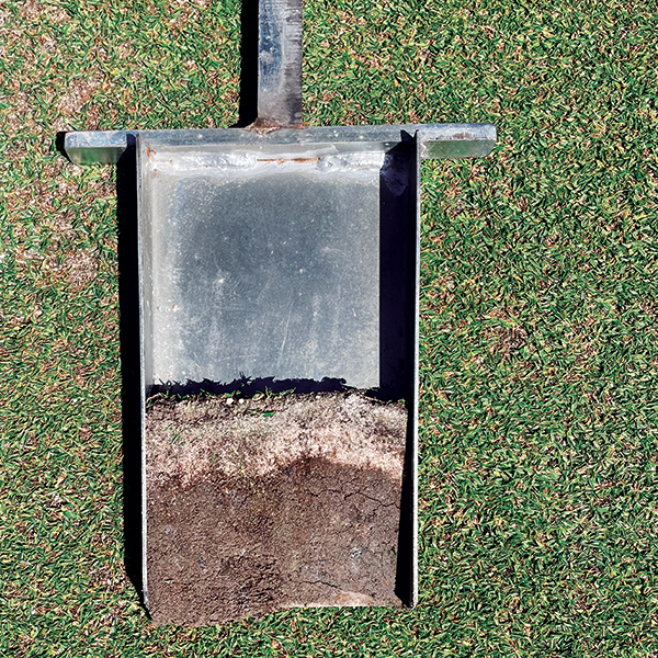 The soil used for the putting green rootzones was obtained from the island. This local soil is frequently amended with sand to continue the process of improving the overall structure and function of the rootzone. 
This soil profile represents a 2-year-old putting green. Local island sand is screened to obtain the sand size needed, which is typical for working in the Caribbean — improvise, find creative solutions and do it all in-house. (Photo: Damon Di Giorgio)