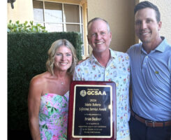 Native bird advocate Brian Beckner (middle) with wife, Susan, and his award from the Florida GCSA presented by president Ryan Swilley, CGCS (right), from The Dye Preserve Golf Club. (Photo: Florida GCSA)