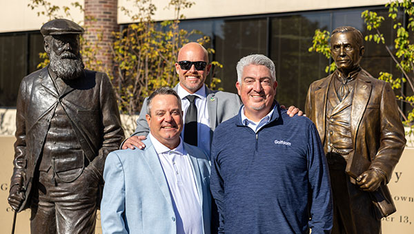 (Left to right) Jim Cummins, National Sales Manager, Golfdom; T.A. Barker, CGCS, Fore Lakes GC, Taylorsville, Utah and Seth Jones, editor-in-chief, Golfdom, get a photo with Old Tom Morris and the new Col. John Morley statue. Barker served as GCSAA’s president in 2025. (Photo: GCSAA)